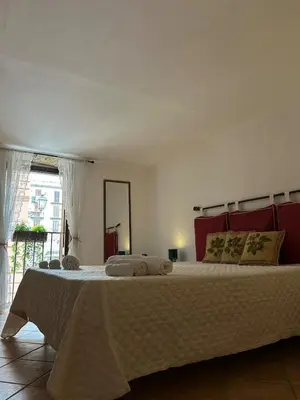 a bedroom with a large bed in a room at Settebello - Antica Mangiatoia Palermitana in Palermo