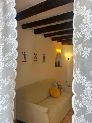 a living room with a couch and a table at Settebello - Antica Mangiatoia Palermitana in Palermo