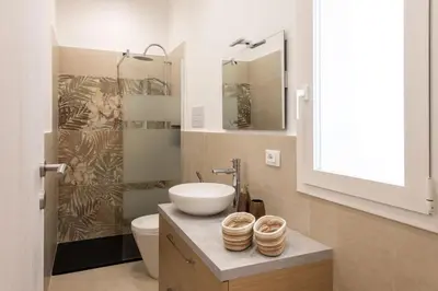 a bathroom with a sink and a toilet at A' meusa Palermo Historic Center Check-in 24h in Palermo