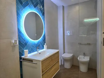 a bathroom with a shower with a shower head at Marèa in Porticello