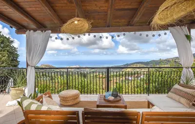 a living room with a view of the ocean at Amazing Home In Caccamo in Caccamo