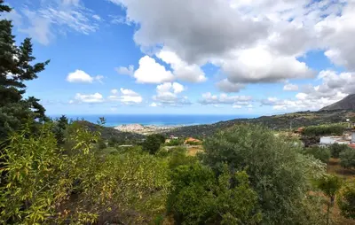 a view of the ocean from a hill with trees at Amazing Home In Caccamo in Caccamo