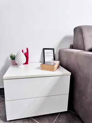 a white chest of drawers next to a couch at Nel Cuore del Capo in Palermo