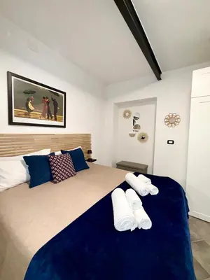 a bedroom with a large bed with two pillows at Nel Cuore del Capo in Palermo