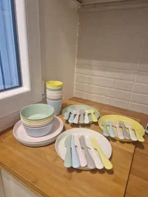 a kitchen counter with plates and utensils on it at Luxury apartment Villa Vera Mondello - Palermo in Mondello