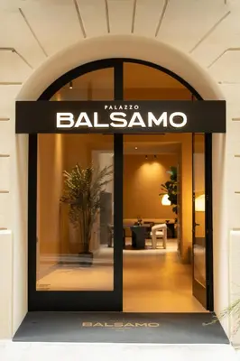 a store window with a balzac sign on it at Palazzo Balsamo Boutique Hotel in Palermo