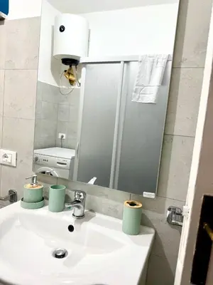 a bathroom with a sink and a mirror at Casa Amuri in Palermo