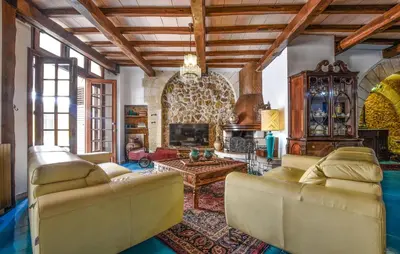 a living room with two couches and a fireplace at Cozy Apartment In Trappeto With Wifi in Trappeto