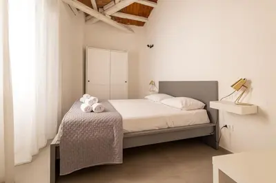 a bedroom with a bed with two stuffed animals on it at Cathedral Apartment - Stay in Palermo in Palermo