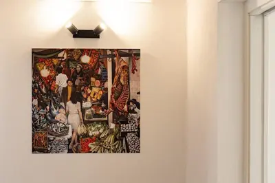 a picture hanging on a wall in a room at Cathedral Apartment - Stay in Palermo in Palermo