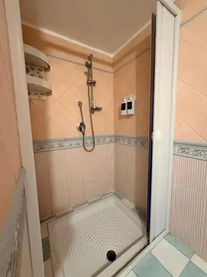 a shower with a drain in a bathroom at Palermo House 29-Central Station in Palermo