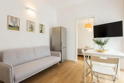 a living room with a couch and a table at Donna Lia Apartment in Palermo