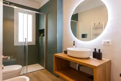 a bathroom with a sink and a mirror at Don Federico Apartment in Palermo