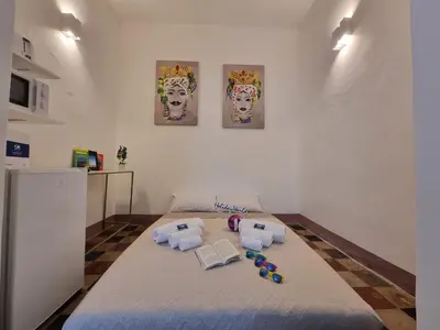 a room with a bed with toys on it at Donna Emma by Holiday World in Carini