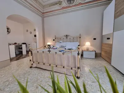 a bedroom with a bed in a room at Donna Elisa by Holiday World in Carini