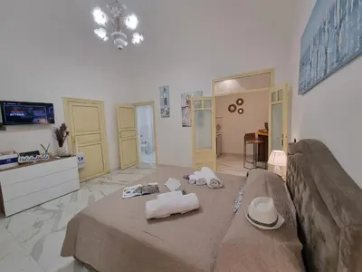 a room with a bed with two pillows on it at Donna Lidia by Holiday World in Carini