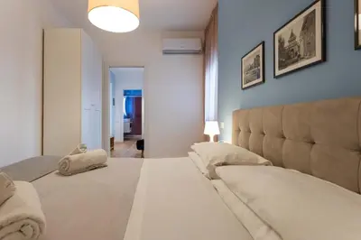 a bedroom with a bed and a couch in it at Don Federico - For Couple in Palermo