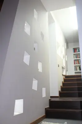 a staircase in a building with a white wall at Imbriani103 in Cinisi