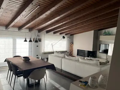 a living room with a table and a couch at Imbriani103 in Cinisi