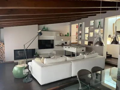 a living room with a white couch and a table at Imbriani103 in Cinisi