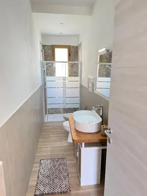 a bathroom with a sink and a toilet in it at La Finestra Sul Tirreno in Terrasini