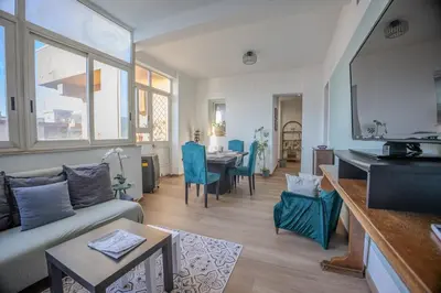 a living room with a couch and a table at Taléa - Design Apartment a Palermo in Palermo