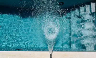 a splash of water in a pool at Design Villa with private pool in Carini