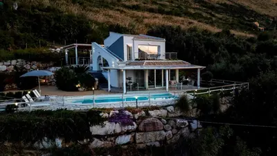 a house with a pool in front of it at VILLA DEI SOSPIRI 4, Emma Villas in Castellammare del Golfo