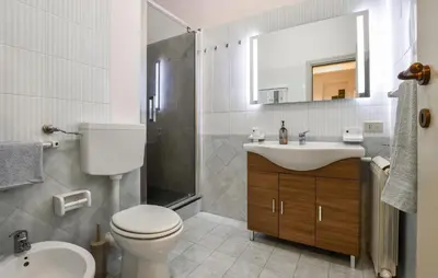 a bathroom with a toilet and a sink and a shower at Amazing Home In Monreale in Monreale