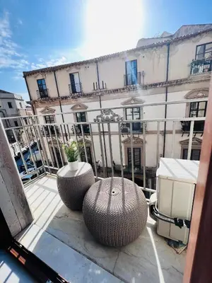 a view of a building from a balcony at Kasa Kaletta Rooms in Palermo