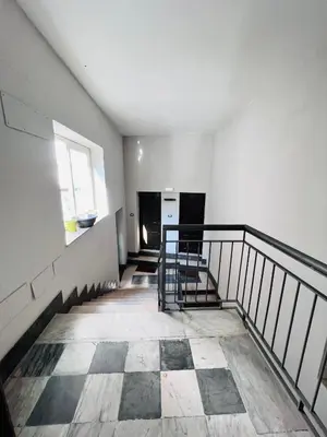 an empty room with a staircase in a building at Kasa Kaletta Rooms in Palermo
