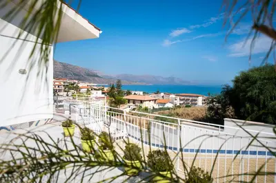 a view of the ocean from a balcony of a house at Villa Cielo d'Alcamo Marina in Alcamo