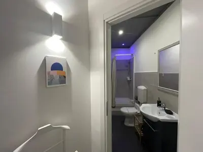 a bathroom with a white sink and a toilet at BB Essenze Club in Palermo