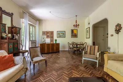 a living room with a couch and a table and chairs at Un Giardino Segreto a Palermo by Wonderful Italy in Palermo