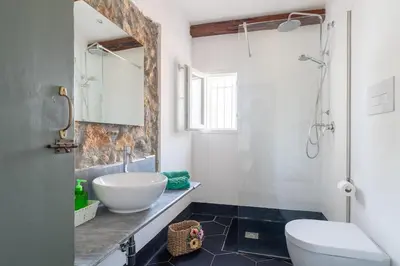 a bathroom with a sink and a toilet and a shower at Baglio del Grillo in Grisi