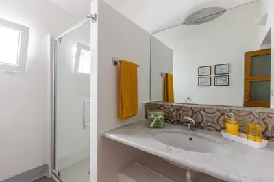 a bathroom with a sink and a shower at Baglio del Grillo in Grisi