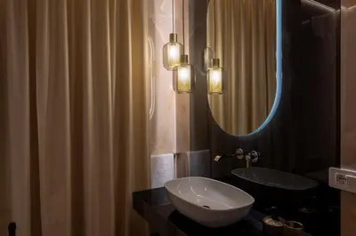 a bathroom with a sink and a mirror at Isidoro Luxury Suites in Palermo