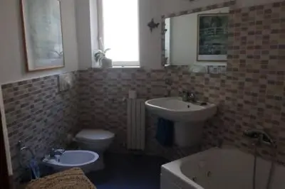 a bathroom with a sink and a toilet and a sink at dimora sammartino in Palermo