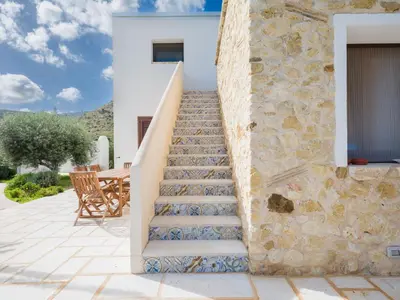 a set of stairs leading up to a house at Villa Aura Scopello in Castellammare del Golfo