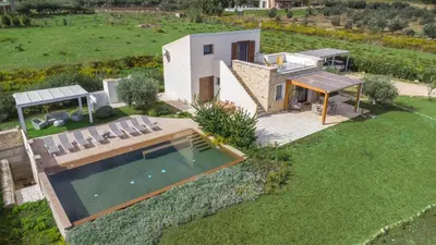 an aerial view of a house with a swimming pool at Villa Aura Scopello in Castellammare del Golfo