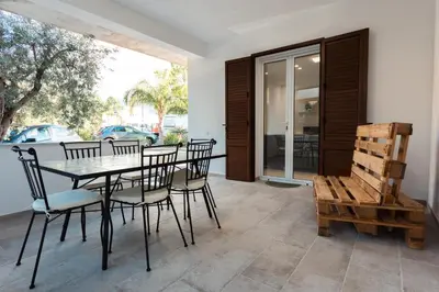 a dining room with a table and chairs at La Dimora di Icaro - near the sea, the Airport and Palermo in Carini