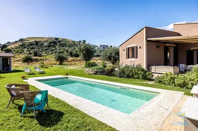 a swimming pool in the yard of a house at Verosicily Villa Pomelia in Termini Imerese