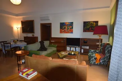 a living room with a couch and a table at Carlita's Home in centro storico a Palermo in Palermo