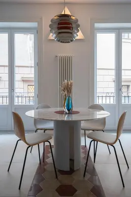 a kitchen with a dining room table and chairs at Casa 3 Cupole, Historic Soul and Contemporary Design in Palermo