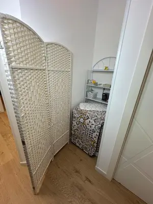 a room with a closet with a shelf and a door at Isole Siciliane Appartamento in Palermo