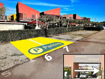 a street sign on the side of a road at Pine Beach House - Villaggio Turistico con Piscina e Animazione in Campofelice di Roccella