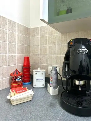 a kitchen counter with a coffee maker on the counter at Da Nonna Marié in Palermo