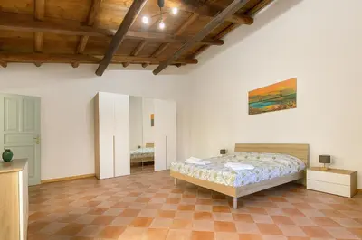 a bedroom with a bed in a room at Cattedrale - Vicolo Brugnò in Palermo
