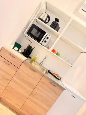 an open kitchen with a sink and a counter at Ughetti Apartment in Palermo