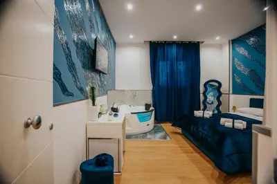 a bathroom with a bed and a sink and a tub at Cama Luxury Rooms in Palermo
